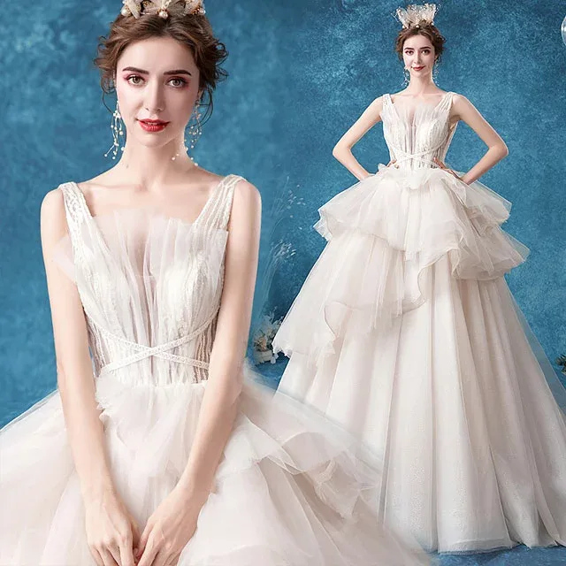 ウェディングドレス ノースリーブ チュール ドレス 結婚式 フリル プリンセスドレス ウェディングドレス トレーンドレス 背開き お洒落 豪華 花嫁ドレス ロング丈 ブライダルドレス 海外挙式 ロングドレス 二次会 披露宴 編み上げ 送料無料