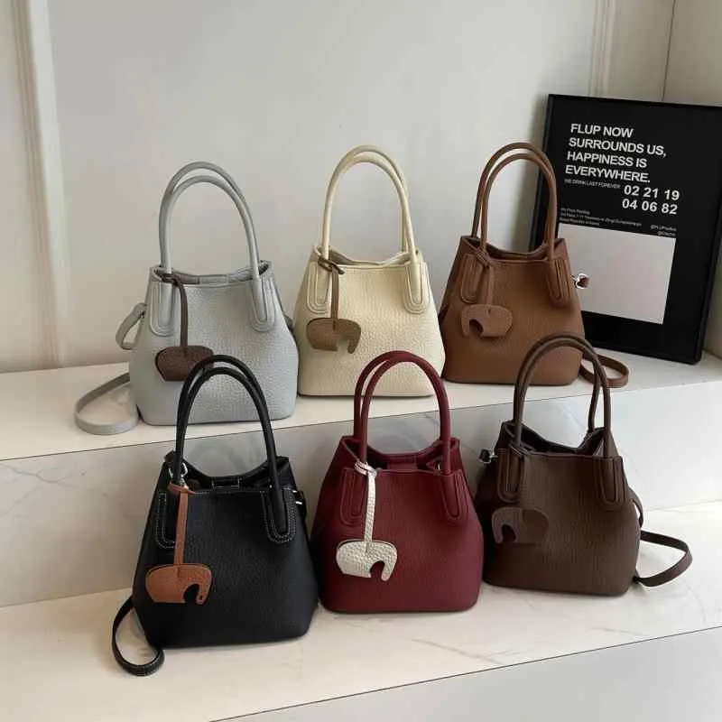 ショルダーバッグ 女性用 バケツ型 韓国 シンプル ライチ革 ユニーク ハンドバッグ 普段使い 肩掛け 鞄 軽量 ファッション