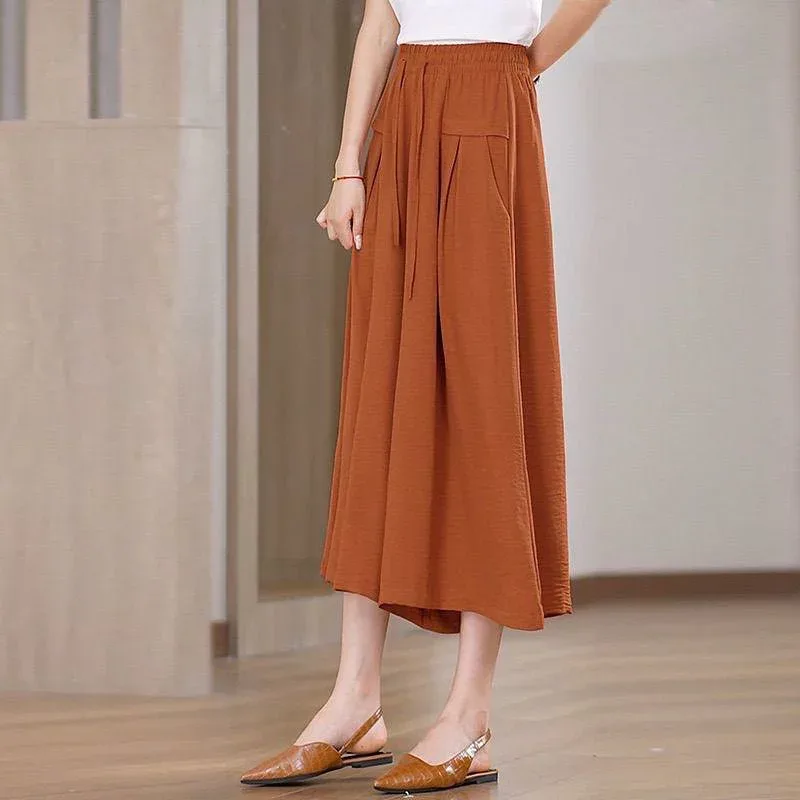 スカートパンツ 女性用 春夏 七分丈 ワイドレッグ 高腰 韓国風 ゆったり 薄手 ポリエステル アニエラ ストレッチ ポケット付き プリーツ ブラウン ブラック オレンジ ワインレッド カーキ ゆったりシルエット 快適 普段使い 軽量 吸湿速乾 御姐スタ