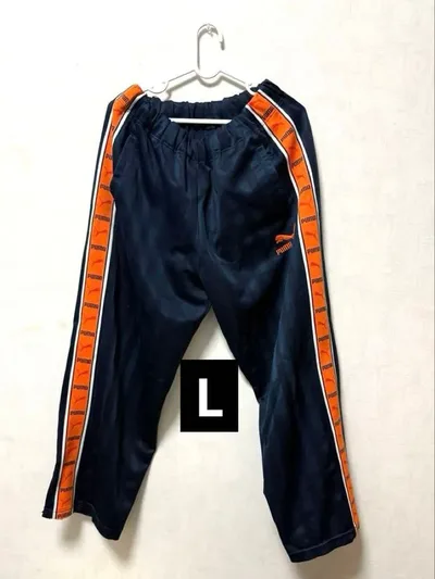 【PUMA / プーマ】サイドテープ ロゴ ジャージ トラックパンツ紺×オレンジ