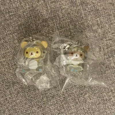 リラックマ きょうりゅう着ぐるみフィギュア めじるしアクセサリー 2種セット