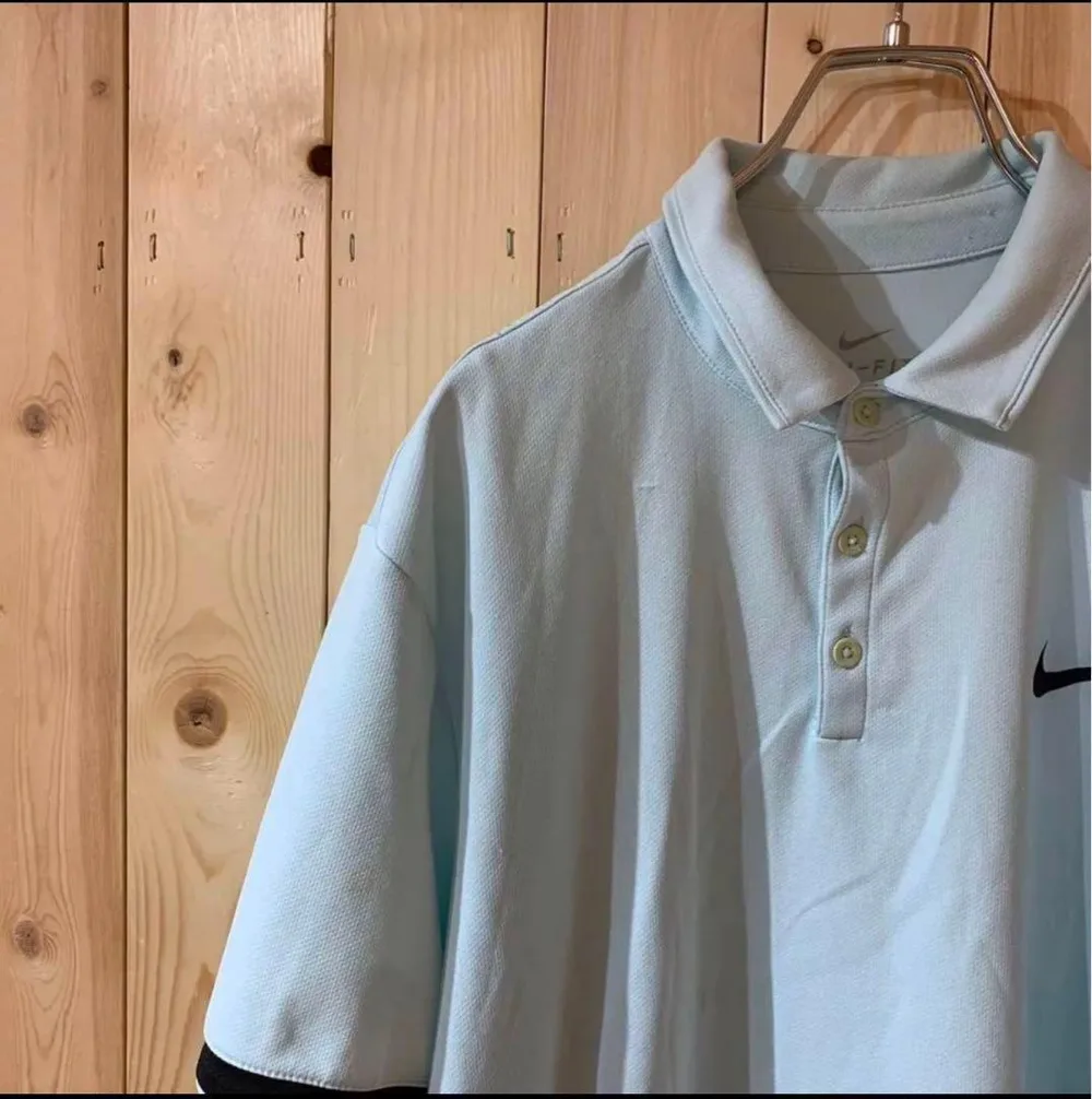 AE1652 NIKEナイキ ポロシャツ ベビーブルー レディース L ポス