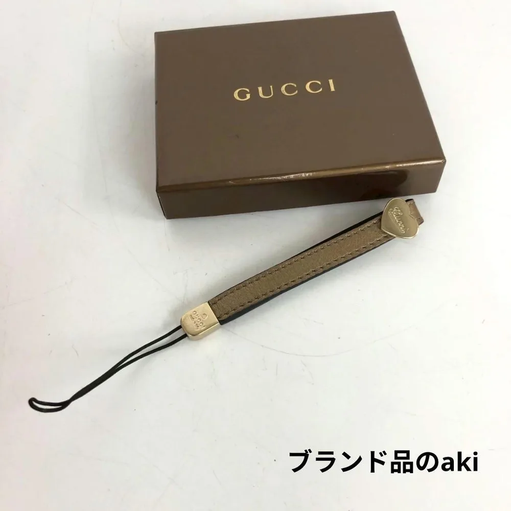 GUCCI グッチ レザー 携帯ストラップ ゴールド ロゴプレート 箱付
