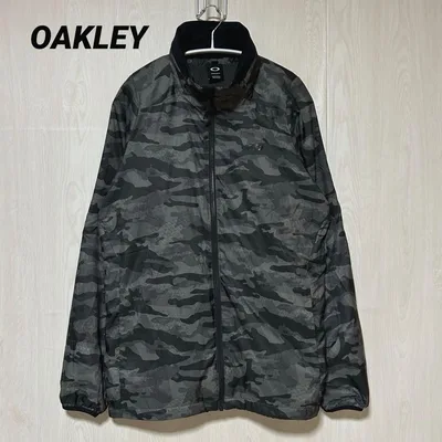 オークリー 18FW カモフラ柄 裏起毛ウインドジャケット 迷彩 JPN XL