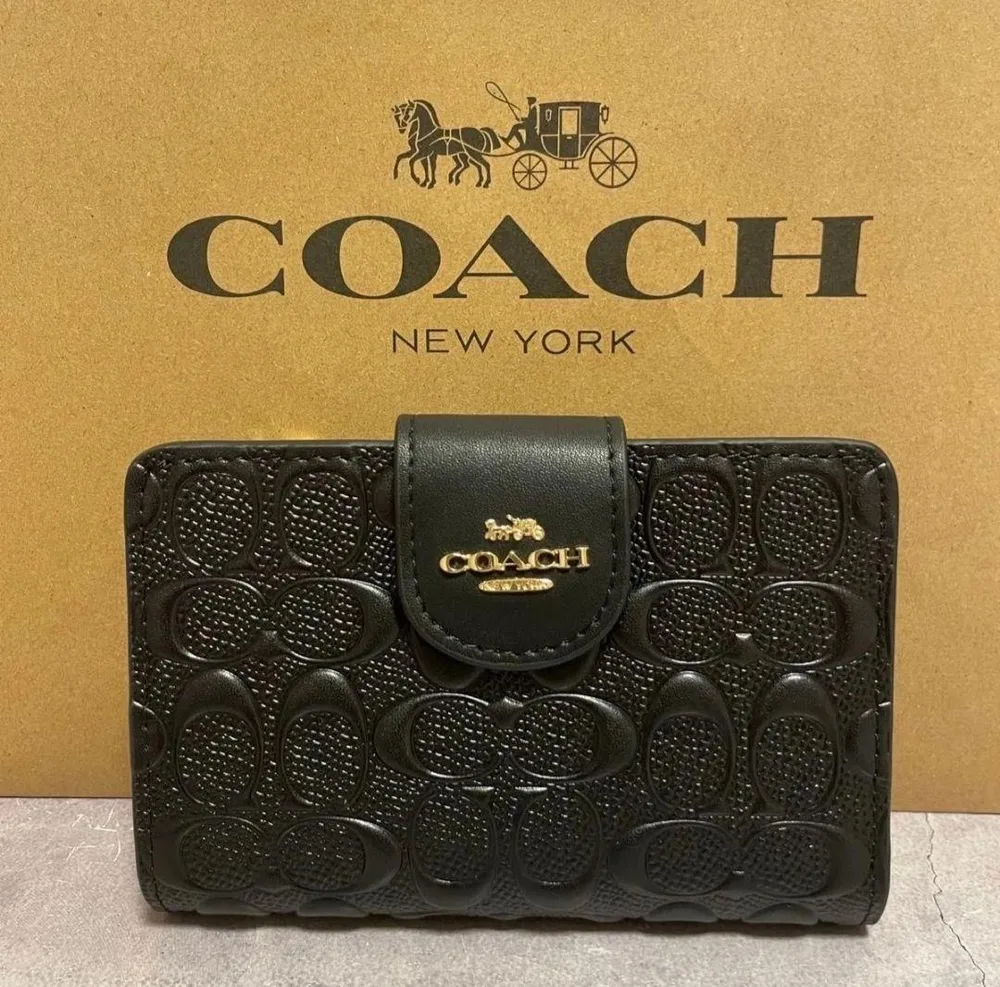 COACH 二つ折り財布 エンボス