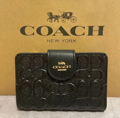 COACH 二つ折り財布 エンボス