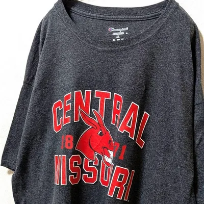 チャンピオン セントラルミズーリ大学ミューズ Tシャツ グレー灰色 XL古着