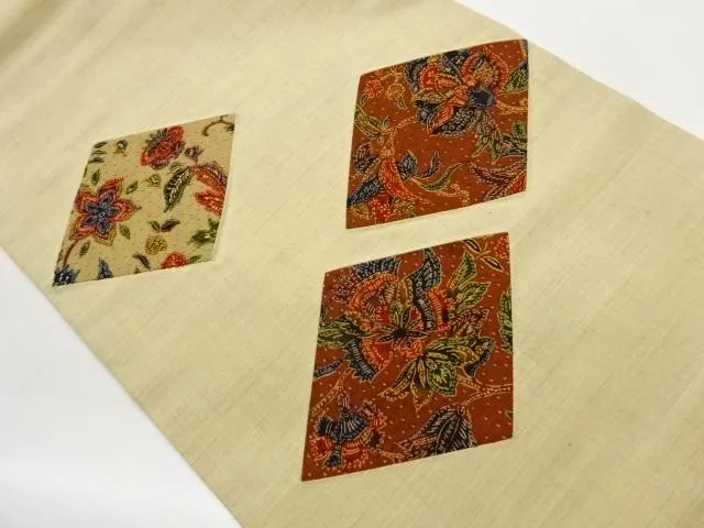 手織り紬切り嵌め相良刺繍菱に草花模様織出し名古屋帯【中古】【着】【名古屋帯】