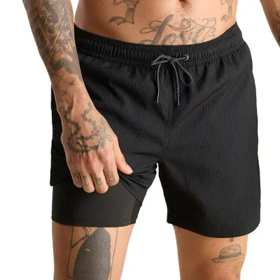 チャビーズ メンズ 水着 ハーフパンツ・ショーツ Chubbies Men's 5.5" Lined Textured Swim Trunksecret Agents