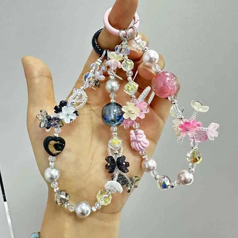 キーホルダー レディース キーリング バッグチャーム かわいい 高級感 頑丈 樹脂製 桜 パールモチーフ